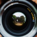 photo through lens leading towards stairs outside